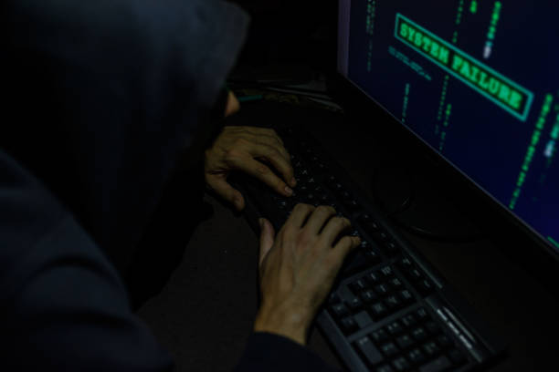istock Hacker attack the server in the dark.Male hacker technology.Anonymous hacker with laptop in the dark. Cyber security concept. 839311154