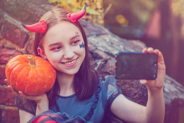 istock Girl makes selfie at Halloween 839318000