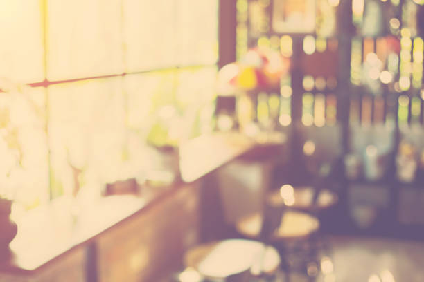 Retro Filter Paris Street Scene Of A Woman (Out Of Focus) Walking Passed A Cafe Bar