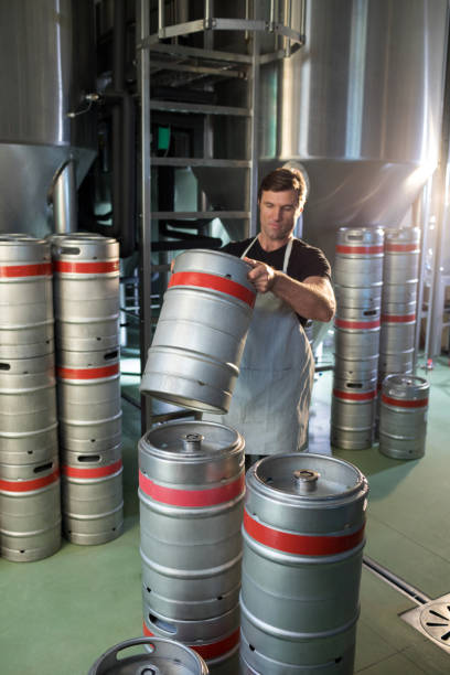 istock Male worker arranging kegs 839341076