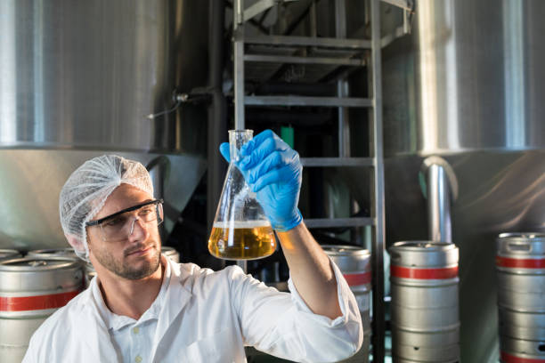istock Scientist examining beer at factory 839341380