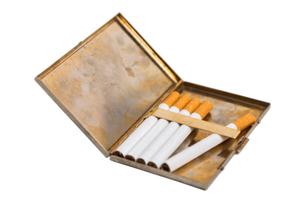 istock Metal vintage opened cigarette case with five cigarettes on isolated background. 839342860