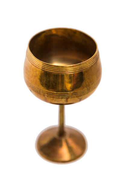 istock Antic gold engraved oriental metal vase on isolated background. 839342864