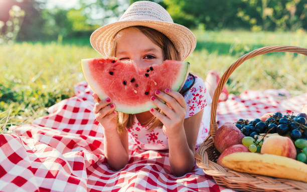 Picnic time. Little girl enjoying in picnic. Nature, lifestyle stock photo