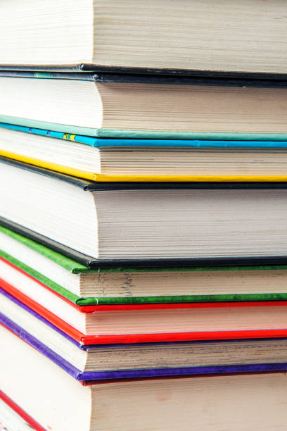istock Stack of books on a shelf, multicolored book spines. 839353712
