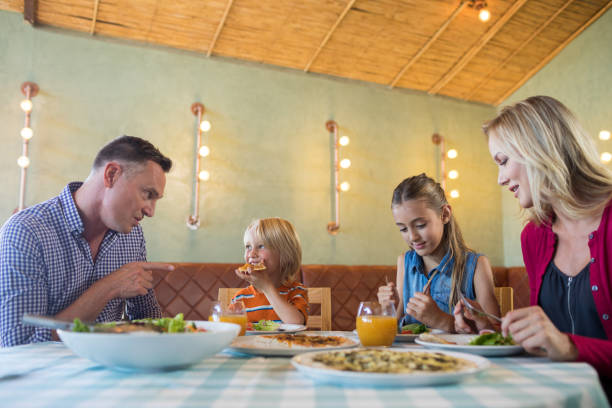 istock Family having food at restaurant 839361506