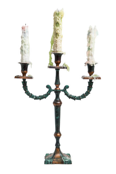 istock Old vintage ancient baroque metal candlestick with three white melted candles 839371942