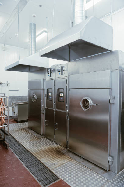 istock Smoking chambers on food processing plant, toned 839372510