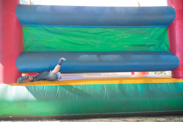 istock Low section of boy playing on bouncy castle 839372544