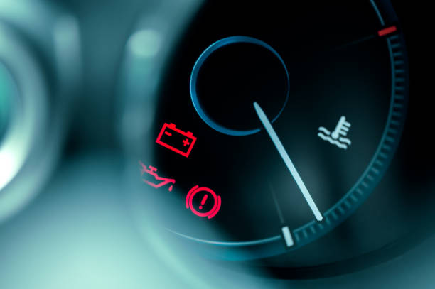 close-up on car dashboard and warning icon stock photo