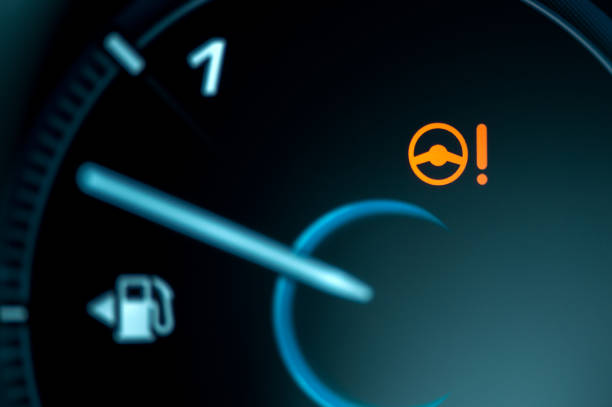 Warning light icon in car dashboard. Power steering failure stock photo