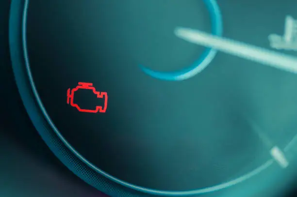 Photo of Check engine light on dashboard of modern car