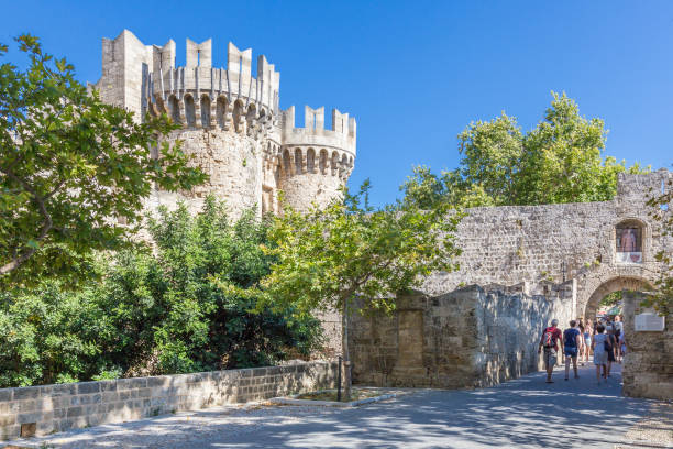 19 JUNE 2017. Tourists in front of the Palace of the Grand Master in Rhodes, Greece stock photo
