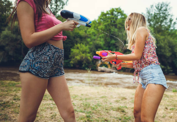 istock Girls playing with water 839410746