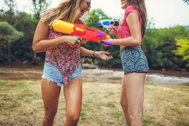 istock Girls playing with water 839410812