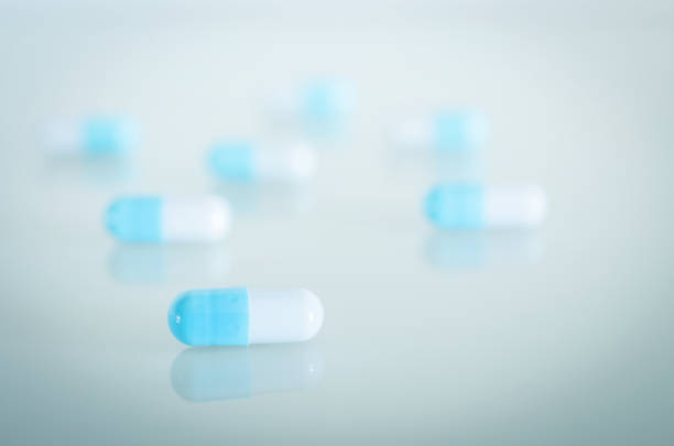 istock Blue and white medical capsules 839421786