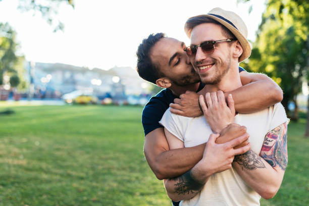 istock Multi ethnic young gay couple kissing 839434946