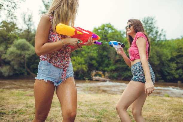 istock Girls playing with water 839441590