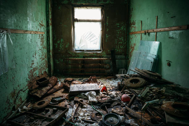 istock Dark dirty room with garbage in an abandoned industrial building 839454316