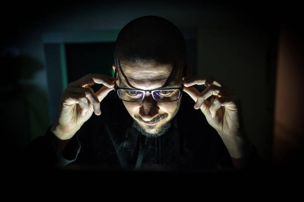 istock Hacker attack the server in the dark.Male hacker technology.Anonymous hacker with laptop in the dark. Cyber security concept. 839459720
