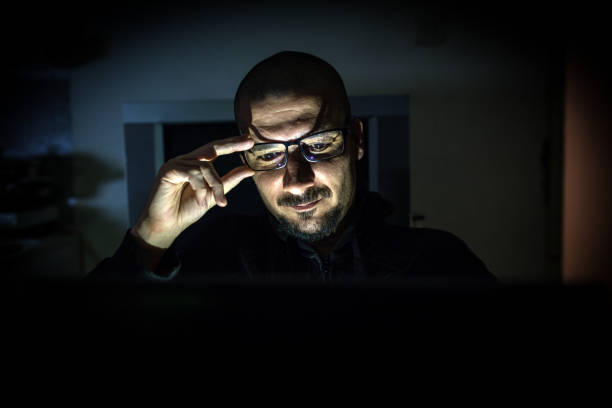 istock Hacker attack the server in the dark.Male hacker technology.Anonymous hacker with laptop in the dark. Cyber security concept. 839459760
