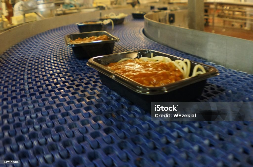 Factory Food Manufacturing Children's Spahetti Bolognaise being manufactured in a high speed factory process Convenience Food Stock Photo