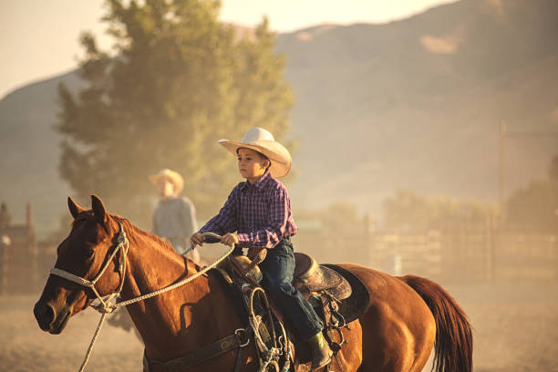 istock child learning to horseback ride 839495150