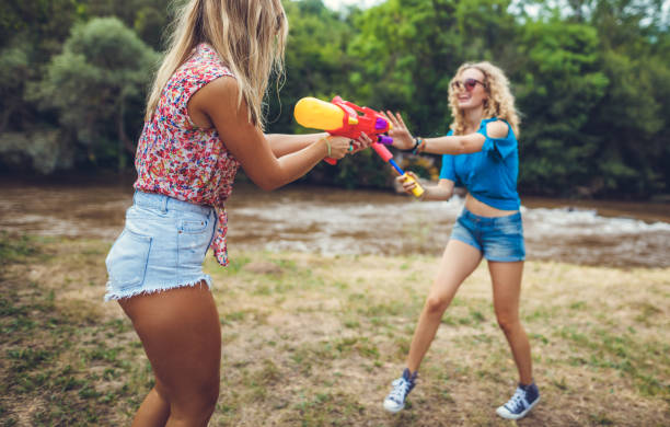 istock Girls playing with water 839495176