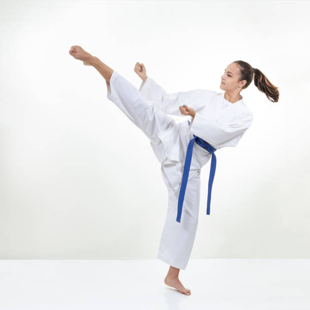 istock A high circular kick kicks the athlete in karategi 839495932