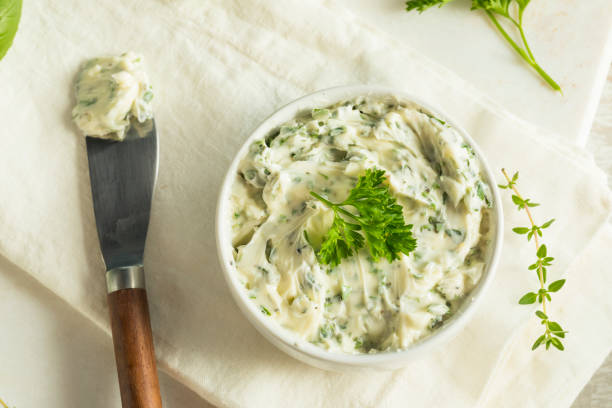 Homemade Organic Herb Butter Homemade Organic Herb Butter with Rosemary Thyme and Parsley butter stock pictures, royalty-free photos & images