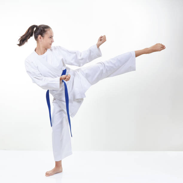 istock On a light background the girl beats a kick 839499596