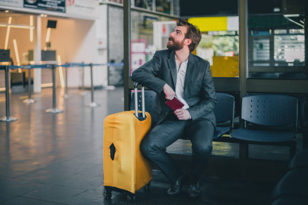 istock Handsome bearded businessman waiting for his flight 839501948