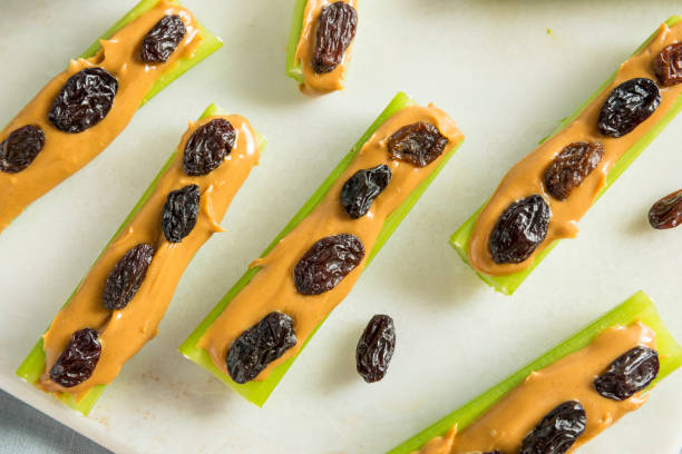 istock Homemade Ants on a Log Snack 839516360