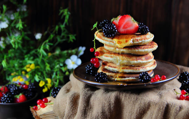 pancakes with fresh berries stock photo