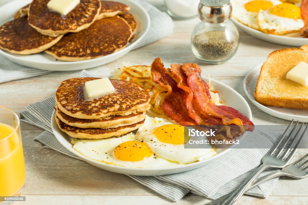 Healthy Full American Breakfast Healthy Full American Breakfast with Eggs Bacon and Pancakes Breakfast Stock Photo