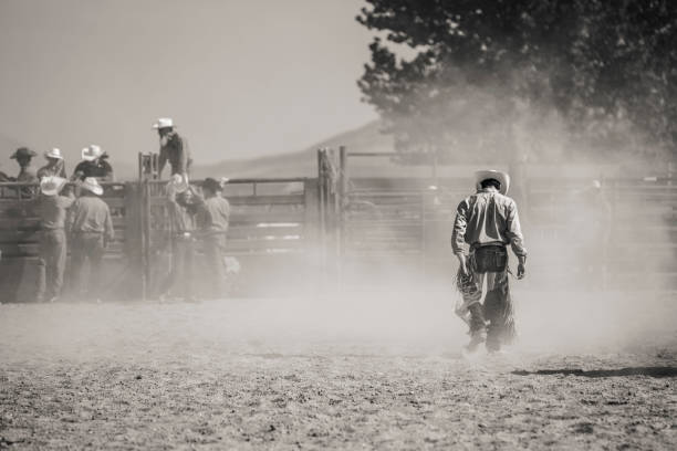Fallen Rodeo Rider A rodeo competitor after his ride corral photos stock pictures, royalty-free photos & images