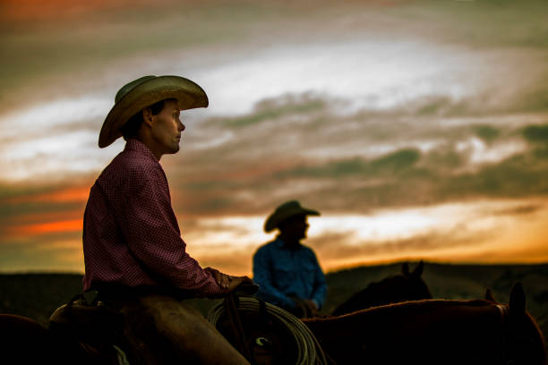istock Cowboy on Horseback at Sunset 839582692