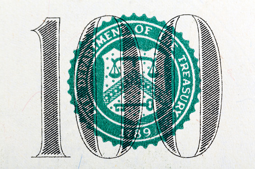 Part of one hundred dollar bill in macro. High resolution photo.
