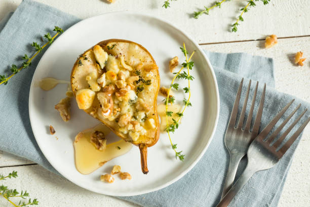 Homemade Baked Pears with Blue Cheese Homemade Baked Pears with Blue Cheese Honey Thyme and Walnuts pear dessert stock pictures, royalty-free photos & images