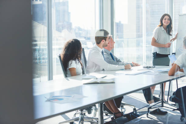 istock Woman giving a presentation to her team. 839628664