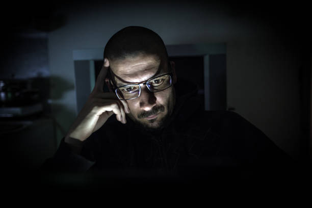 istock Hacker attack the server in the dark.Male hacker technology.Anonymous hacker with laptop in the dark. Cyber security concept. 839637558