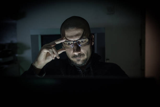 istock Hacker attack the server in the dark.Male hacker technology.Anonymous hacker with laptop in the dark. Cyber security concept. 839637572
