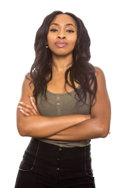 Black Female Expressions on White Background Black female isolated on a white background displaying facial confident expressions. She is young and of African American ethnicity. snob stock pictures, royalty-free photos & images