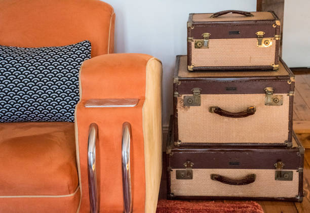 istock Art deco orange lounge and luggage. 839698372
