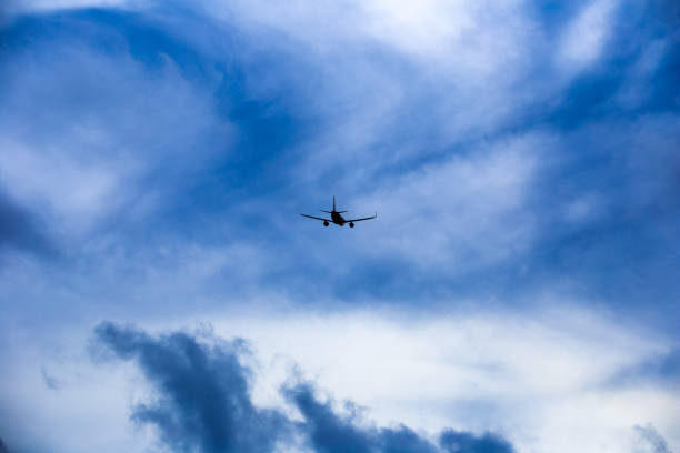 istock Airplane in the sky and cloud at sunset 839790392