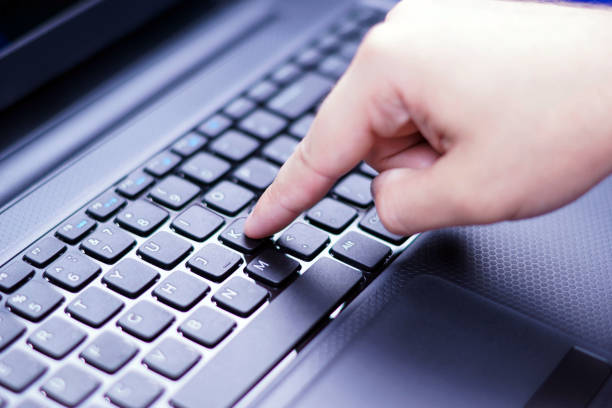 istock Finger presses a key on the laptop keyboard 839791462