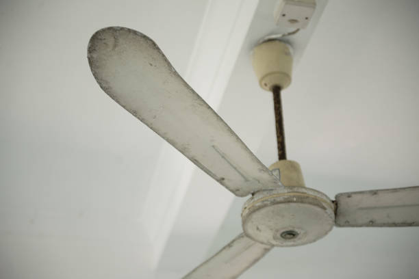 istock Low Angle View of an old rusty ceiling fan in an old house 839794014