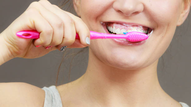 istock Woman brushing cleaning teeth 839794988