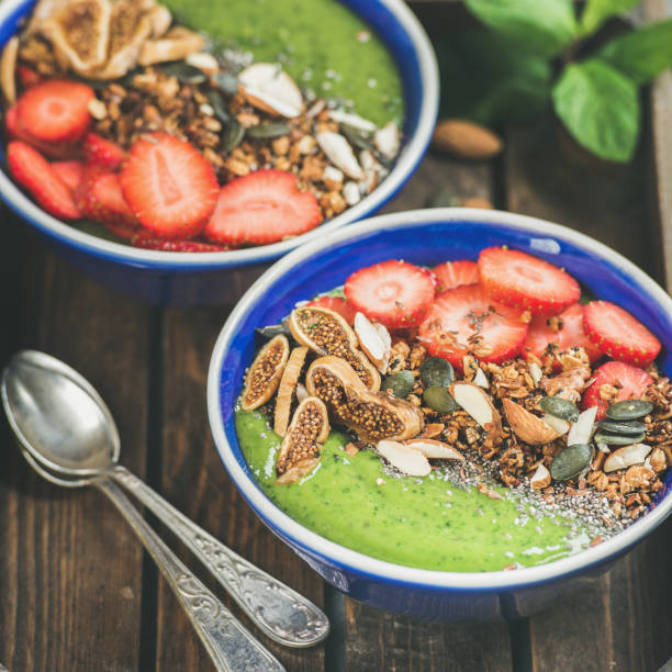 istock Healthy breakfast, Green smoothie bowls with granola, fruit, nuts 839800180