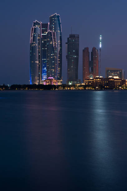istock Abu Dhabi buildings skyline from the sea at night 839805598